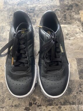 Puma Black Athletic Sneakers with Gold Accents